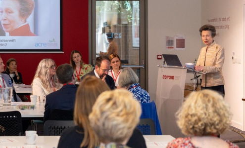 HRH Princess Anne, the Princess Royal, standing at a lectern