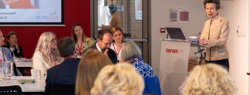 HRH Princess Anne, the Princess Royal, standing at a lectern